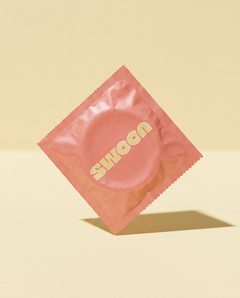 Single Swoon condom in a pink foil wrapper